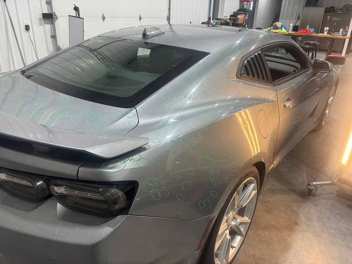 Hail-dented roof mapped for paintless dent repair at the Hail Solutions Olathe shop