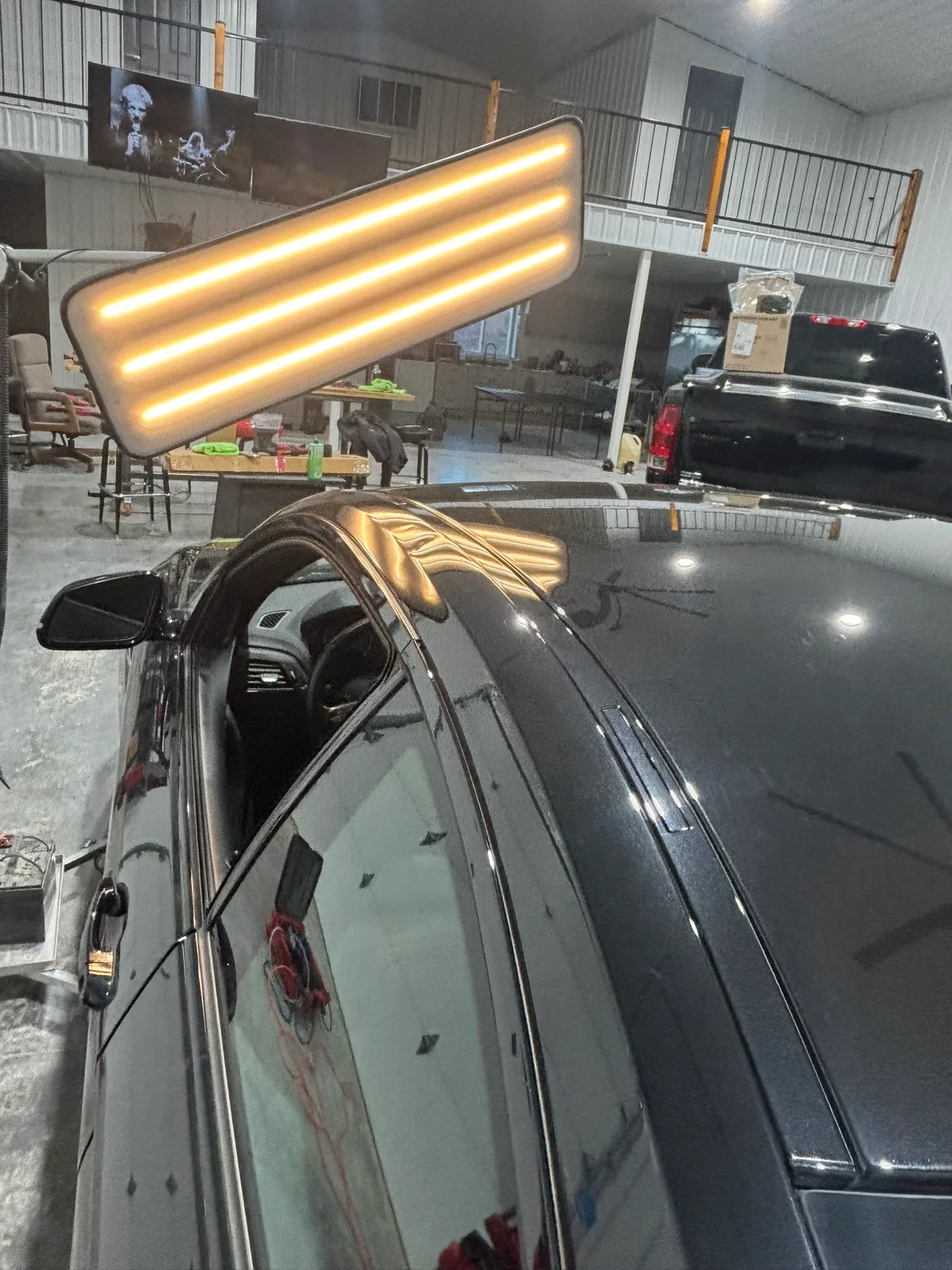 Paintless dent repair in progress at the Hail Solutions Olathe shop
